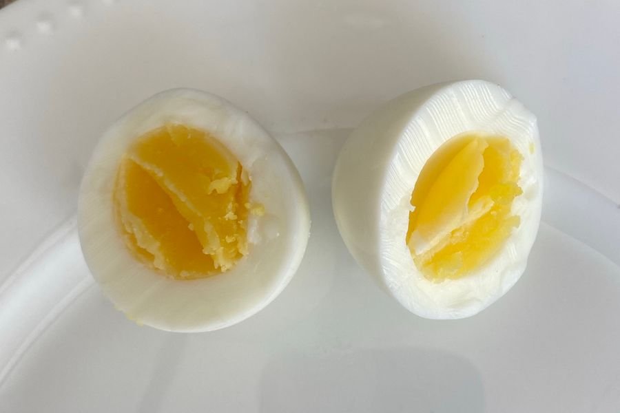 A large egg boiled 8 minutes and cut across into two halves, the yolk set at the edge with a slightly soft centre